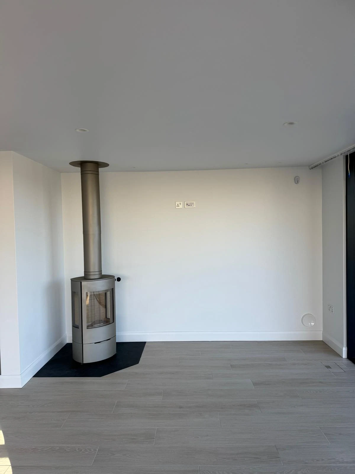 New build living room with wood-burning stove