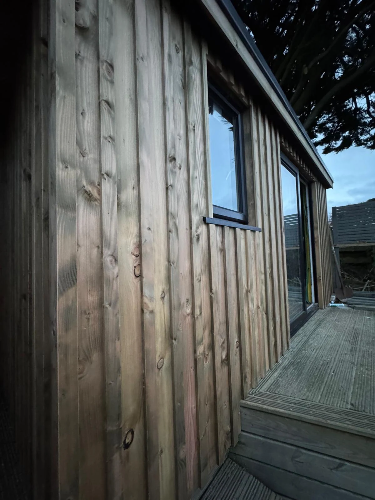 Close-up of vertical timber cladding on a bespoke garden office