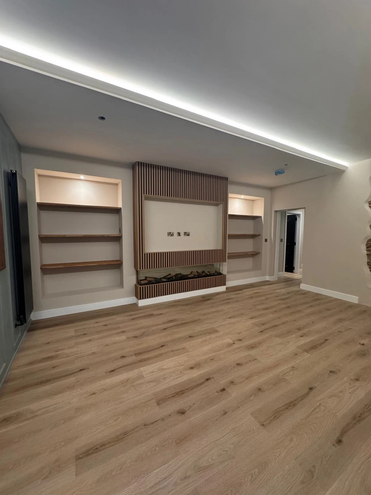 Built-in shelving and media wall joinery with LED lighting