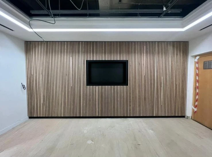 Finished timber slatted feature wall with integrated TV