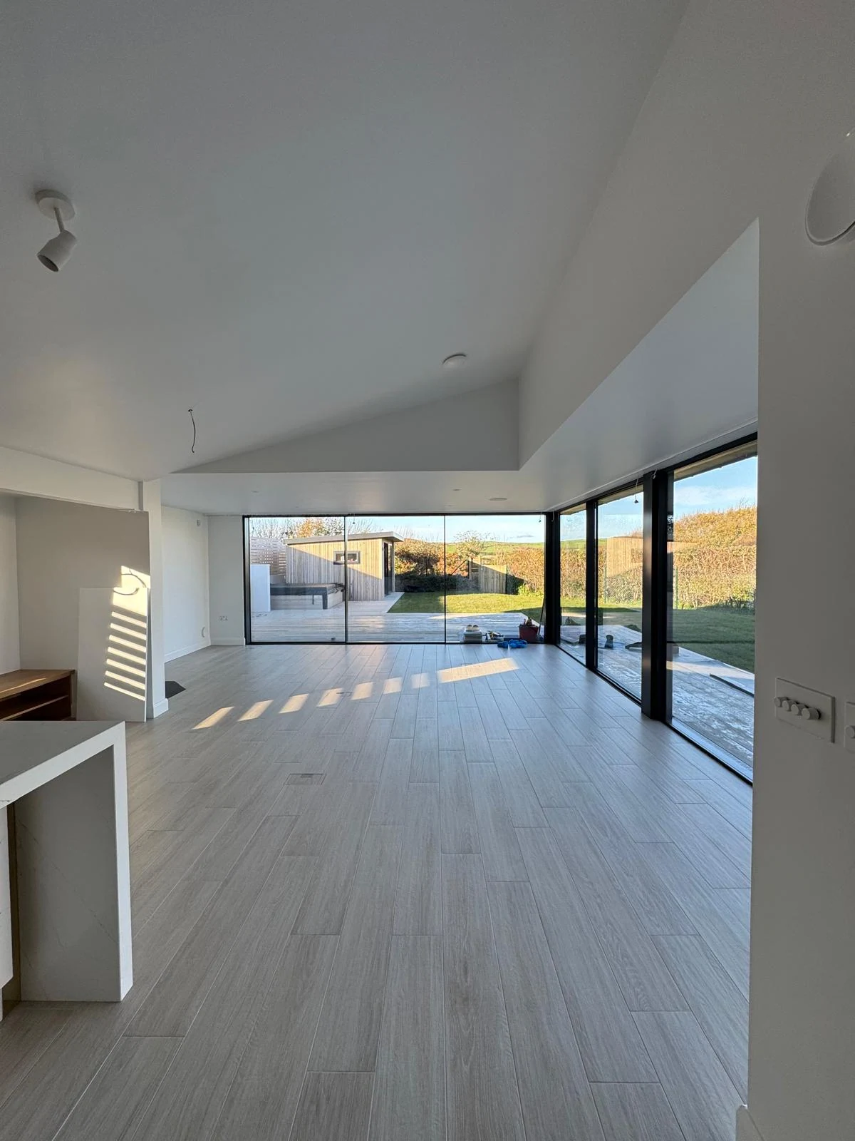 Open-plan new build interior with corner glazing