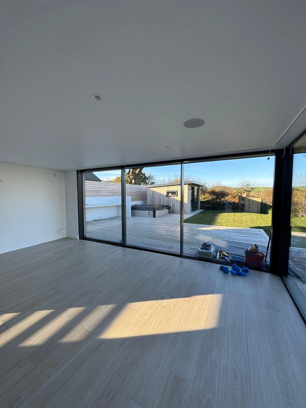 New build living space with floor-to-ceiling glazing
