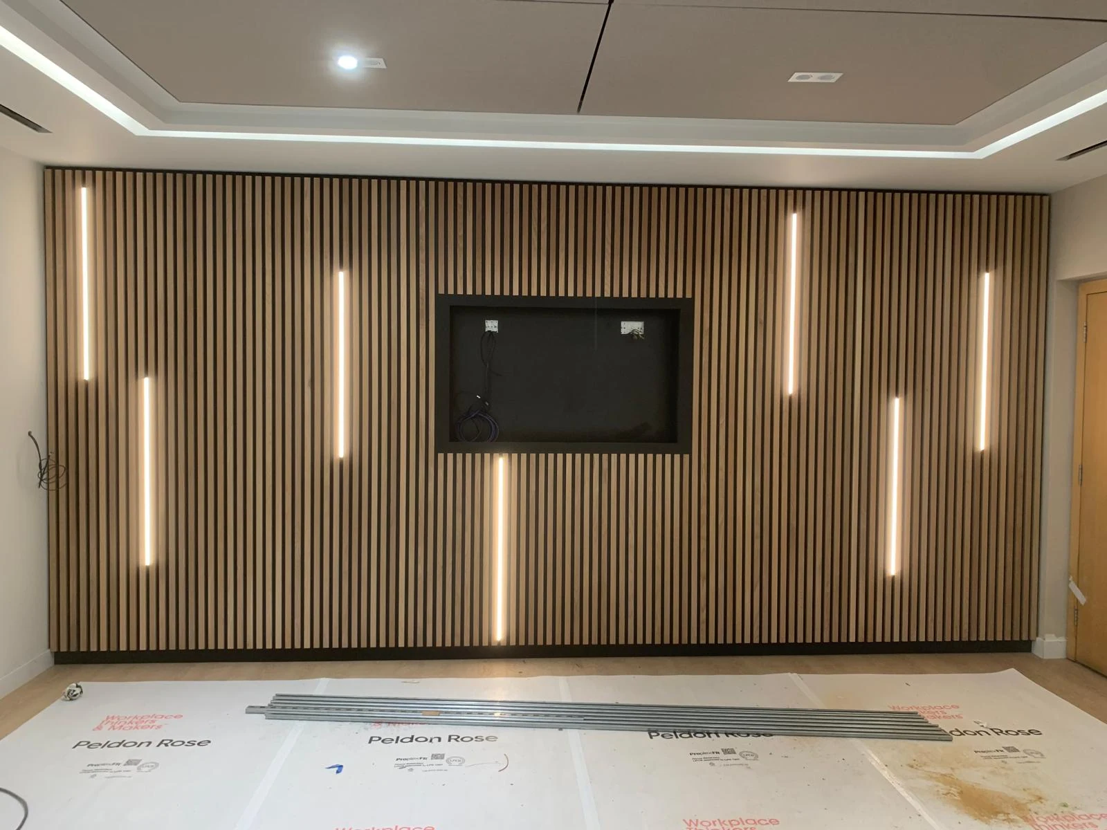 Timber slatted feature wall with LED strips and TV recess