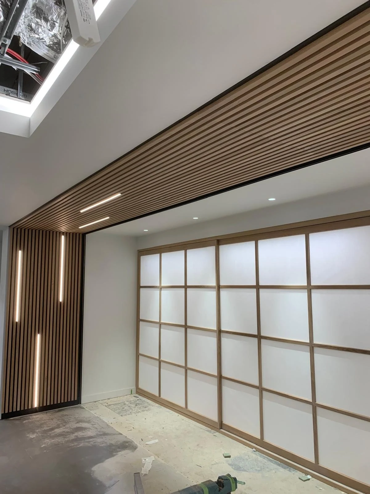 Slatted timber ceiling over Japanese-style screen doors