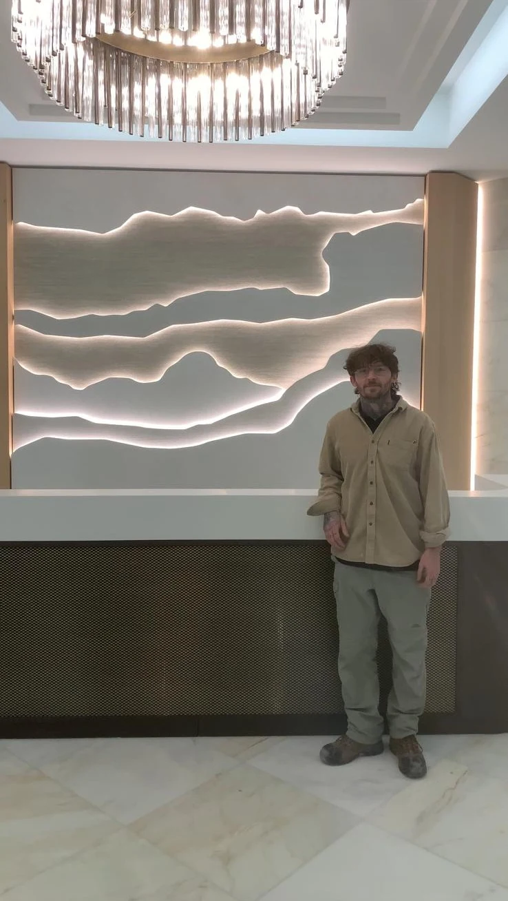 Completed illuminated feature wall and reception joinery
