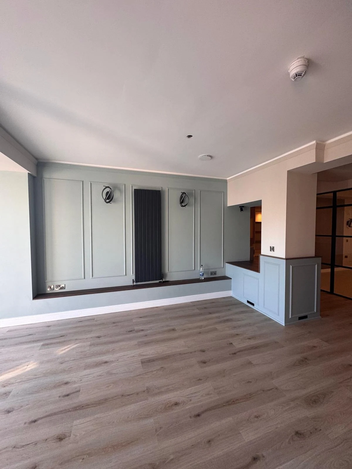 Open-plan interior with bespoke panelling and fitted joinery