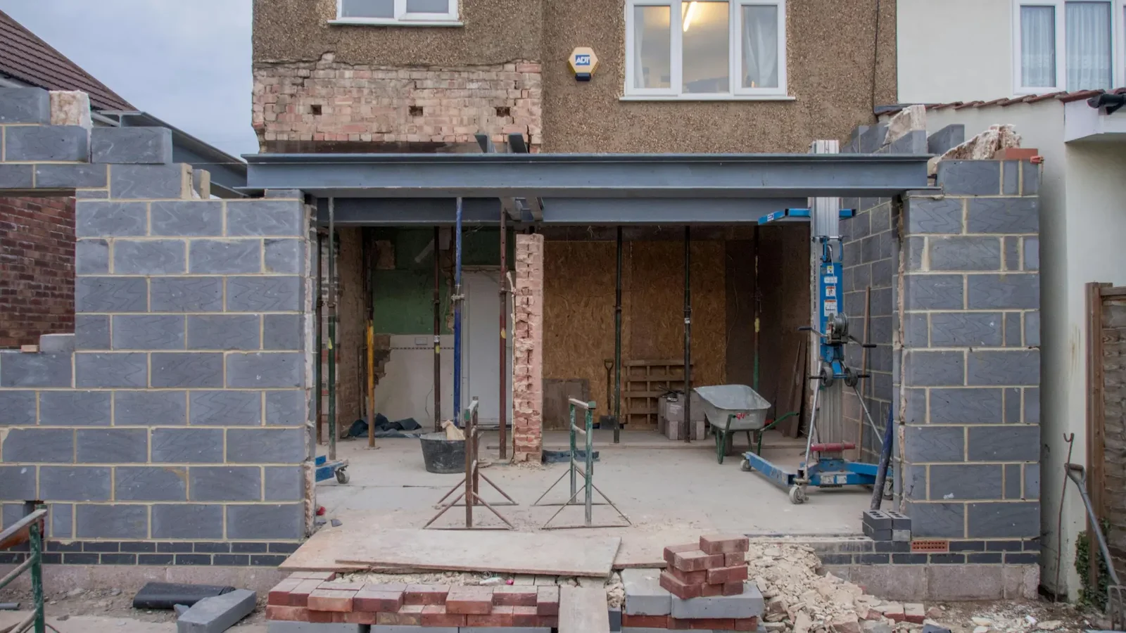 Stock photograph of a house extension under construction with blockwork and a structural steel beam