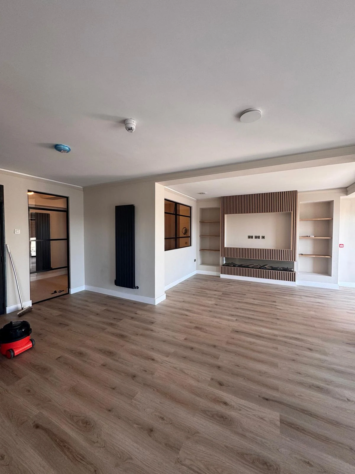 Built-in media wall joinery under construction in a living room